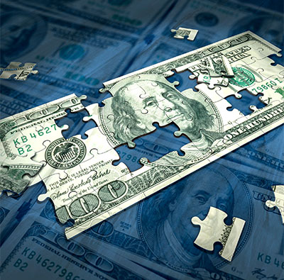 blue background with puzzle pieces depicting a $100 dollar bill